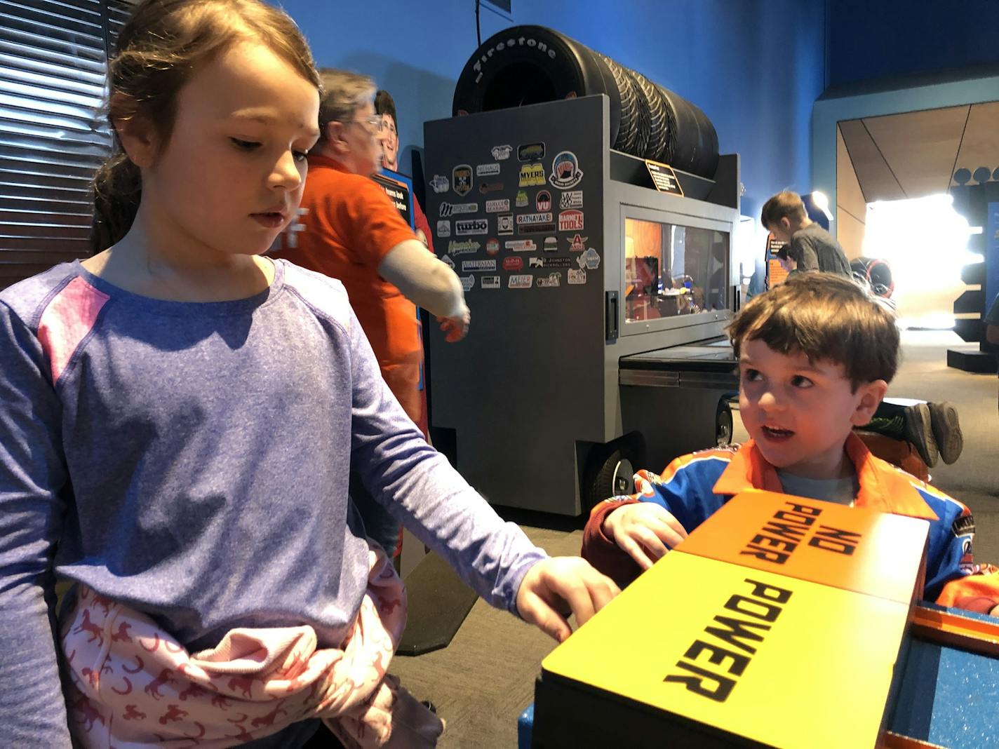 Eden and Abraham Cleberg prepare to race Hot Wheels cars down a two-lane racetrack Monday, Jan. 20.