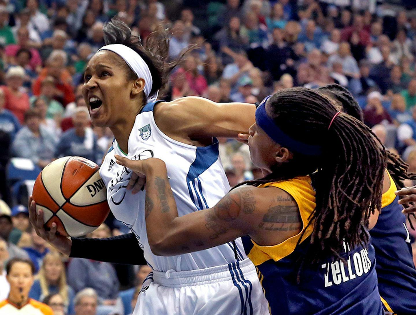 Lynx Maya Moore got fouled on the way to the hoop by Indiana's Shavonte Zellous during the first half