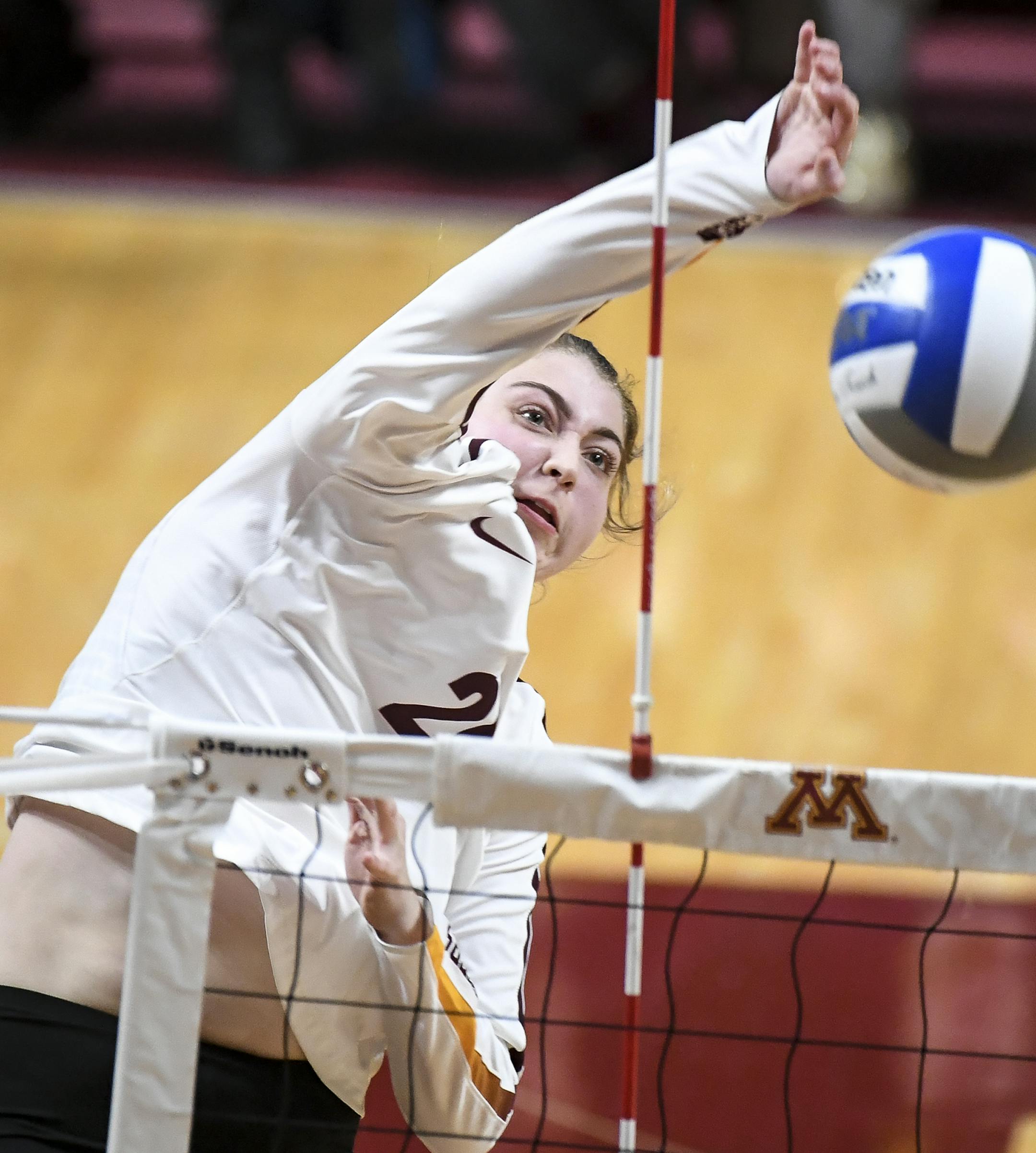 Minnesota middle blocker Regan Pittman (21) hit the ball for a kill in the first set against Creighton. ] Aaron Lavinsky • aaron.lavinsky@startribune.com The Minnesota Gophers played the Creighton Bluejays in the second round of the NCAA Volleyball Tournament on Saturday, Dec. 7, 2019 at Maturi Pavilion in Minneapolis, Minn.