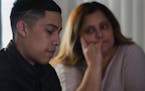 Javier Mercado's mom Julia Cadena, right, listens while her son tells of his harrowing story March 6, 2018, of a home robbery when he was hiding in hi