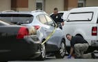 FILE - In this June 18, 2014, file photo Cobb County police investigate an SUV where a toddler died near Marietta, Ga., when the father forgot to drop