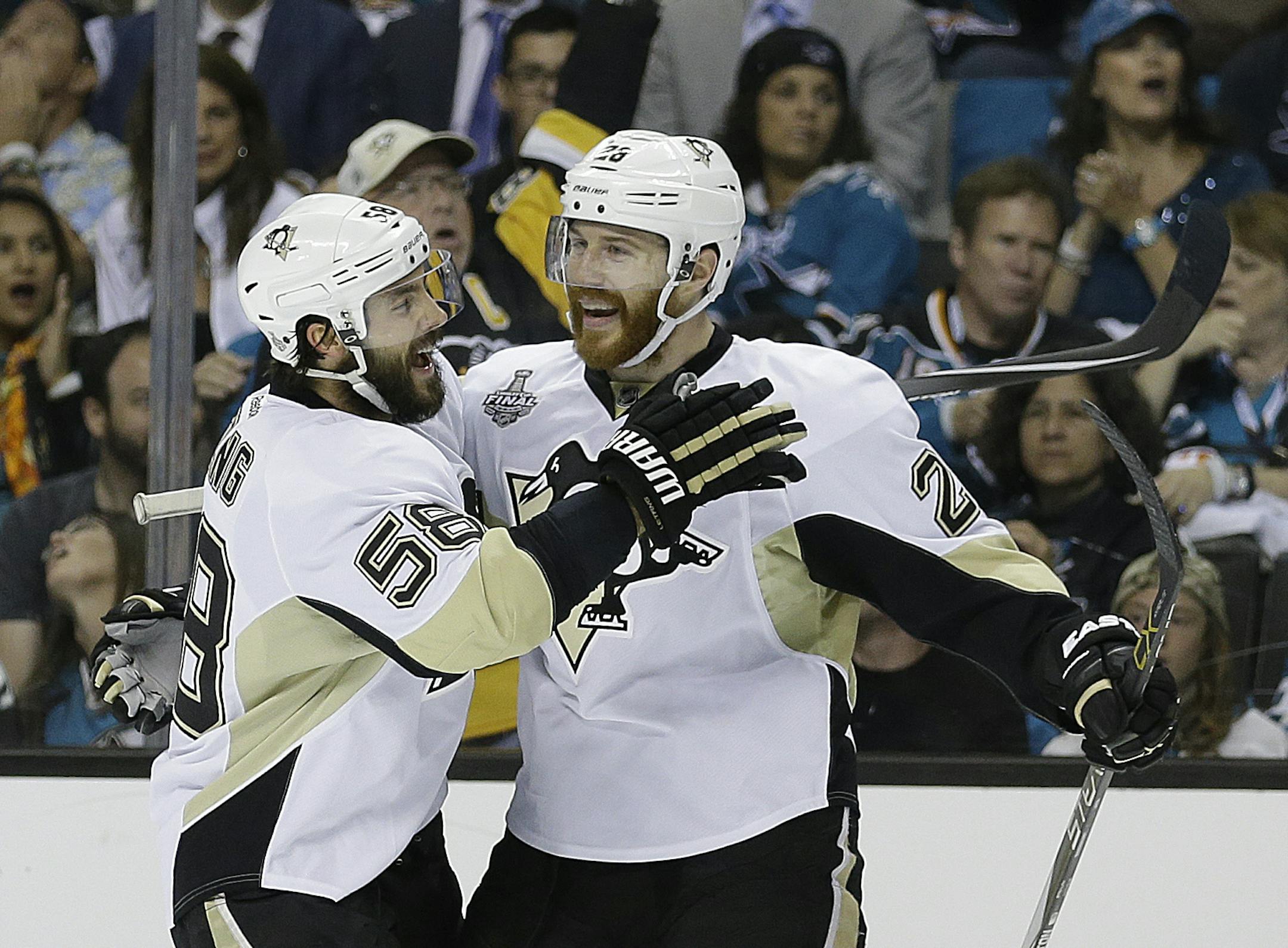 The Penguins’ Kris Letang, left, celebrated with Ian Cole after Cole scored in the first period to put the Pittsburgh up 1-0 in Game 4 of the Stanley Cup Final on Monday night. Pittsburgh, on the road, beat San Jose 3-1 to take a commanding 3-1 lead in the series.