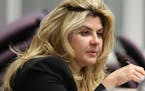 FILE - In a Monday, June 3, 2013 file photo, Nevada Assemblywoman Michelle Fiore, R-Las Vegas, works in committee during the final day of the 77th Leg