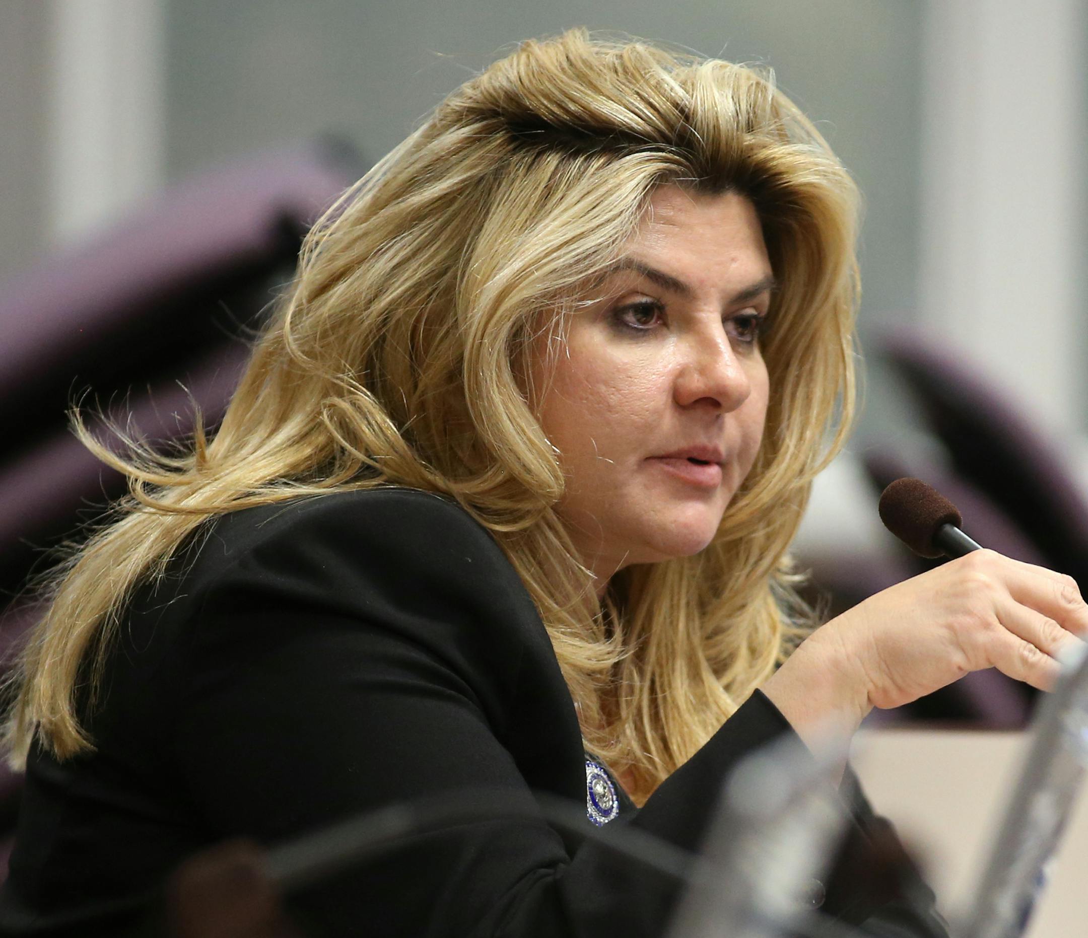 FILE - In a Monday, June 3, 2013 file photo, Nevada Assemblywoman Michelle Fiore, R-Las Vegas, works in committee during the final day of the 77th Legislative session at the Legislative Building in Carson City, Nev. Fiore spoke Wednesday, Feb. 10, 2016, to some of the four occupiers of a national wildlife refuge in Oregon. As David Fry and Sean Anderson yelled back and forth with the FBI, Fiore spoke to them and Sandy Anderson on a phone, telling them she could only help them if they stayed aliv