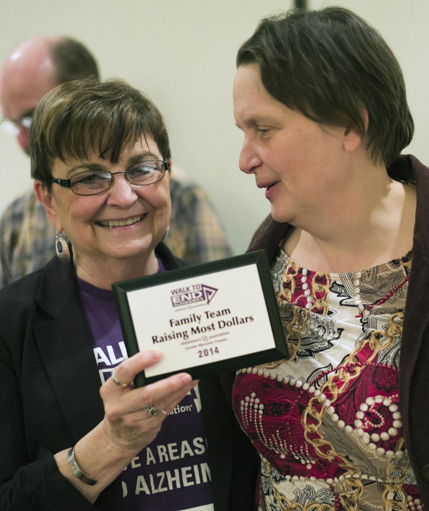 At a function in Eau Clair celebrating fundraising efforts for alzheimer in Wisconsin, Janet Rubenzer-Pike,left, celebrated with daughter Julie Anderl, who has early-onset dementia. Janet Rubenzer-Pike has led efforts to organize downtown businesses in Chippewa Falls to undergo training to be "dementia-friendly."]Richard Tsong-Taatarii/rtsong- taatarii@startribune.com