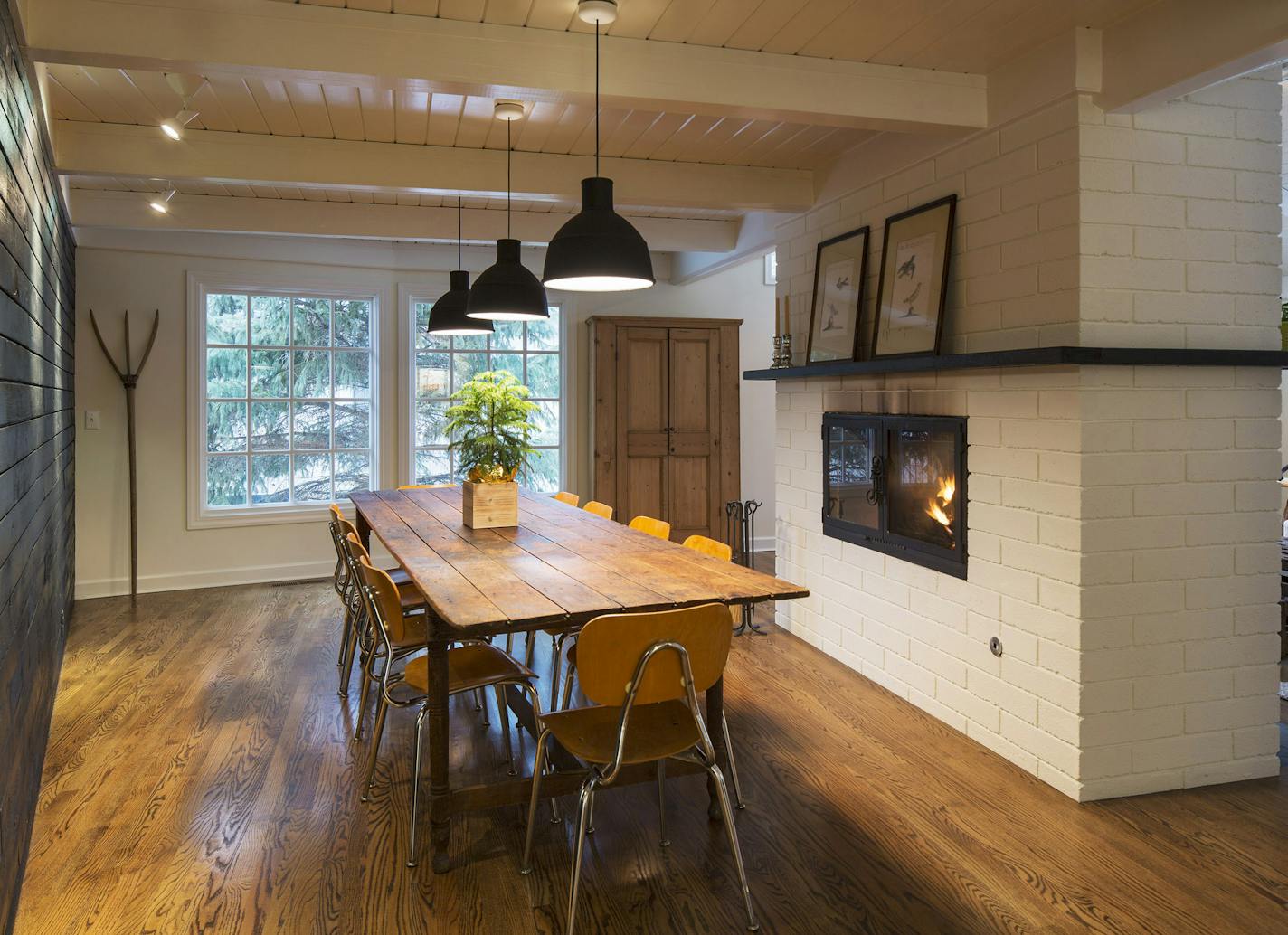 The dining room is framed by a charred-fir wall, with lights shining on its rough texture, and a freshened woodburning brick fireplace.
See more photos online at startribune.com/homegarden.