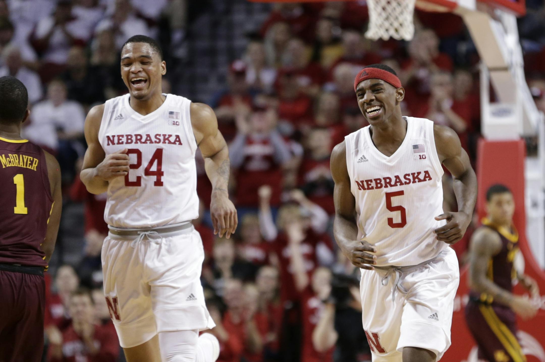 Nebraska's Glynn Watson Jr. (5) laughs with teammate James Palmer Jr. (24), after scoring a basket off a steal during the second half of an NCAA college basketball game against Minnesota in Lincoln, Neb., Tuesday, Dec. 5, 2017. Nebraska won 78-68.