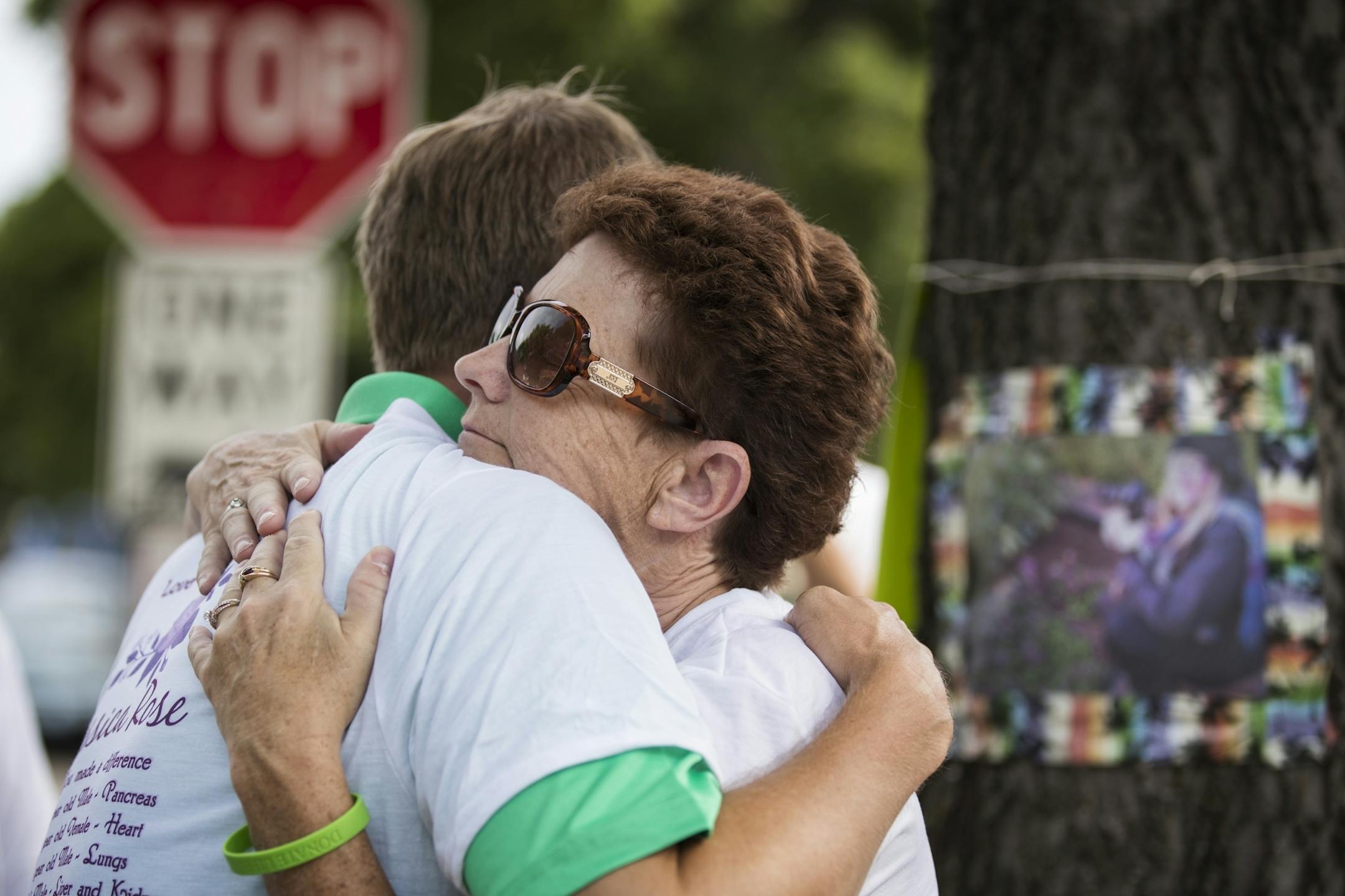 Natalie Hanson, the mother of Jessica Hanson, hugs a well-wisher during a memorial for her daughter.