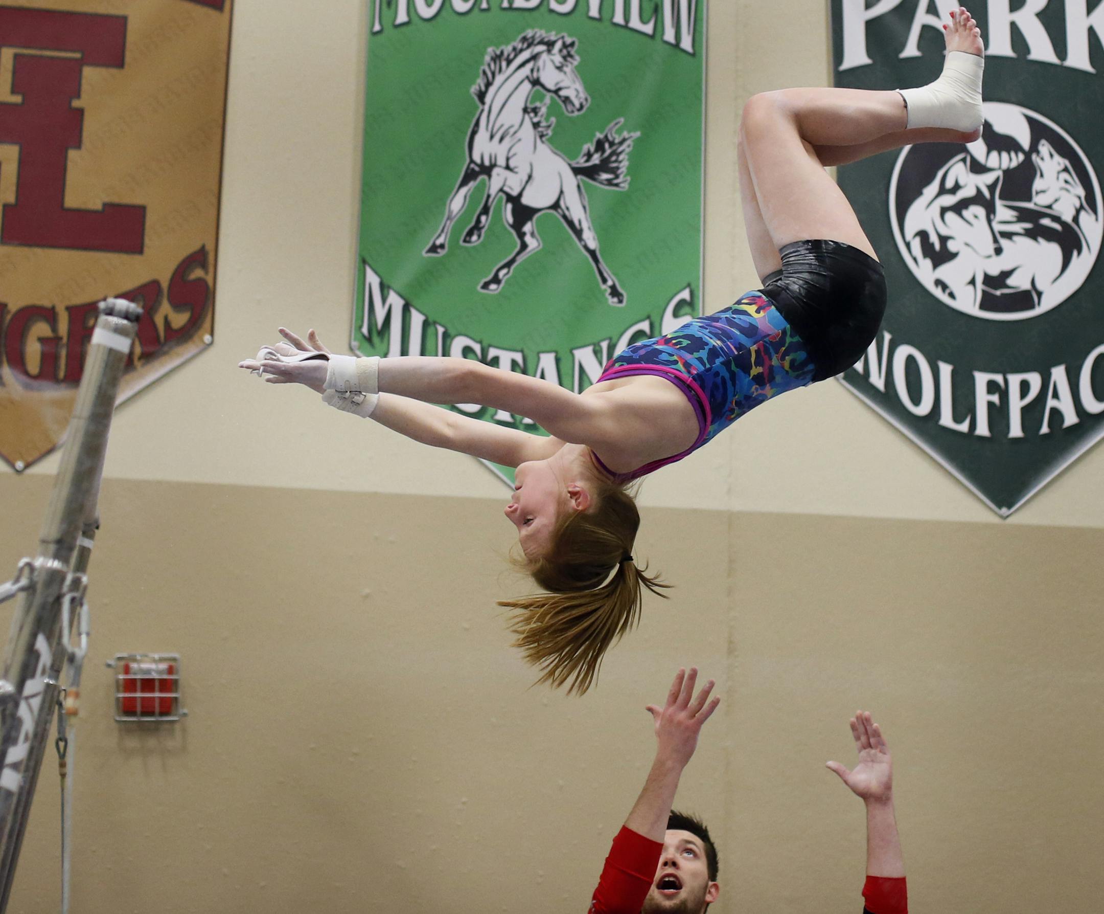 Taryn Johnson of East Ridge gymnastics team was spotted by coach Chris Madura during practice Monday January 26, 2015 Woodbury, MN.] Jerry Holt/ Jerry.Holt@Startribune.com