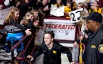 In front of an ever-growing mass of supporters, Caitlin Clark walks out for warmups Wednesday at Williams Arena to face the Gophers. As she's done all