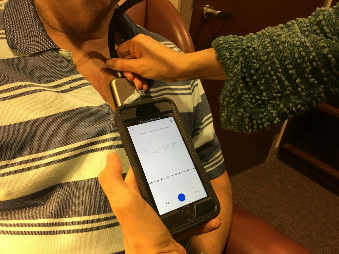 Study coordinator Jennifer Dugan of the Mayo Clinic in Rochester demonstrates how the Eko Duo digital stethoscope can listen to the heart and take an electrocardiogram (ECG), and also transit the data wirelessly via a cellphone. The device is part of an ongoing clinical trial at Mayo.