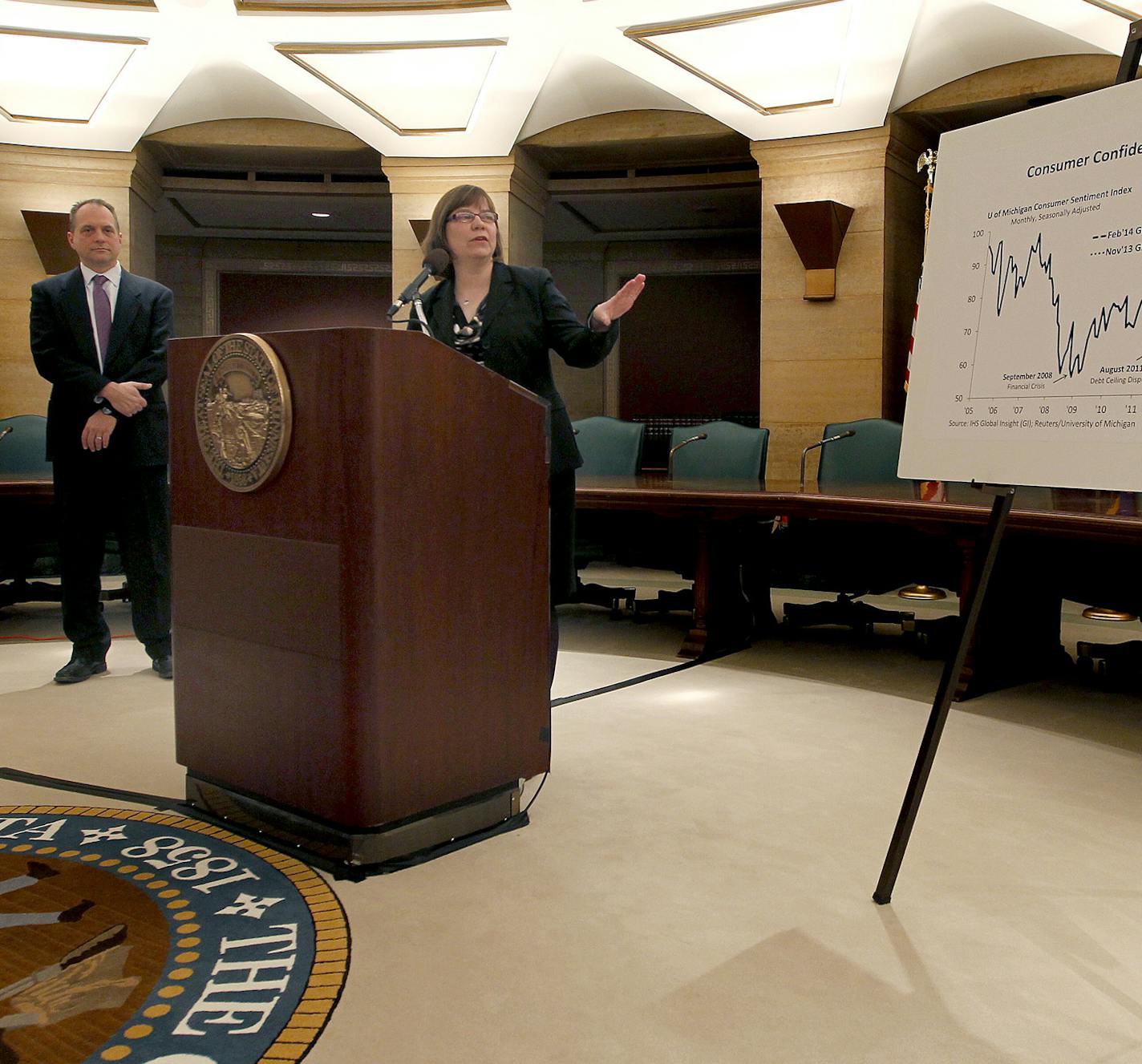 State Economist Laura Kalambokidis, center, along with Minnesota Management and Budget Commissioner Jim Schowalter, left, shared details of the new economic forecast that shows Minnesota state leaders have more than $1 billion in extra money to spend during a press conference at the State Capitol, Friday, February 28, 2014. ] (ELIZABETH FLORES/STAR TRIBUNE) ELIZABETH FLORES &#x2022; eflores@startribune.com ORG XMIT: MIN1402281223430857