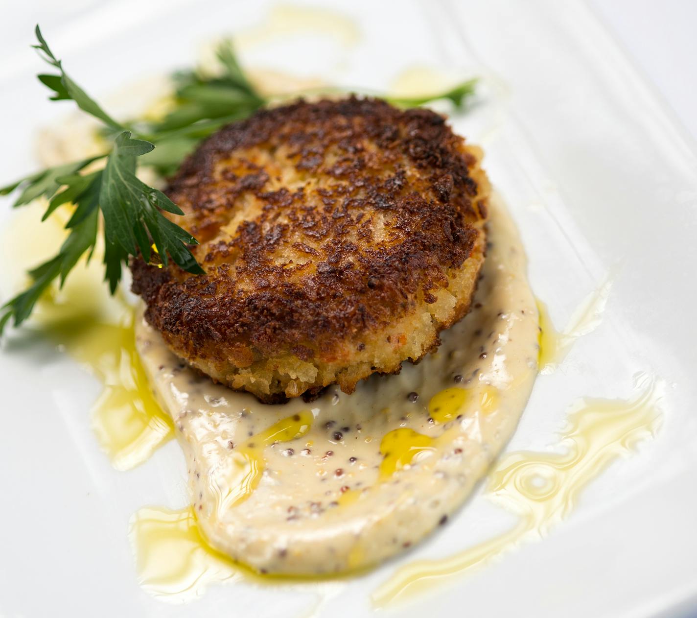 Crab cake with mustard aioli.