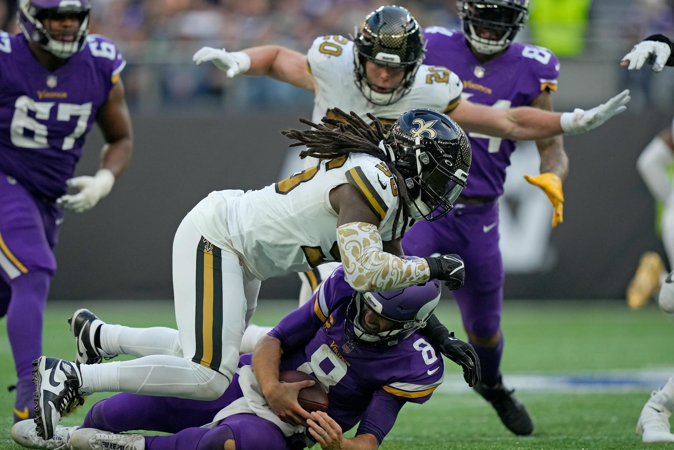New Orleans Saints linebacker Demario Davis (56) sacks Minnesota Vikings quarterback Kirk Cousins (8).