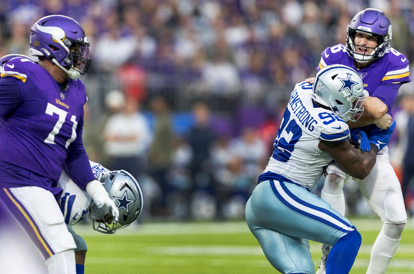 Dorance Armstrong (92) of the Dallas Cowboys pressures Minnesota Vikings quarterback Kirk Cousins (8) as Christian Darrisaw (71) looks on in the first quarter Sunday, November 2, 20220, at U.S. Bank Stadium in Minneapolis, Minn. ] CARLOS GONZALEZ • carlos.gonzalez@startribune.com.