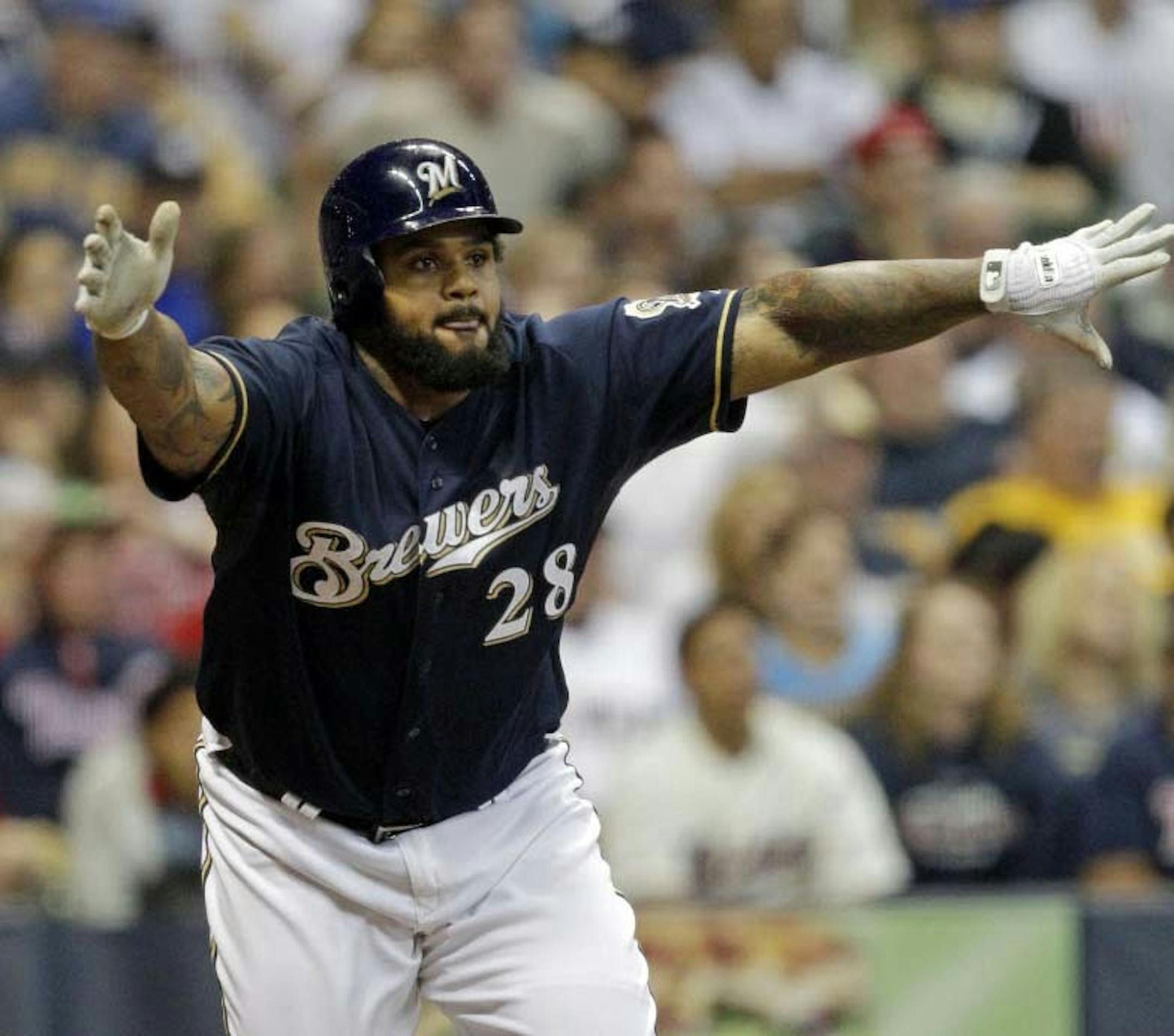 Milwaukee Brewers' Prince Fielder reacts after hitting a two run-scoring double during the seventh inning of a baseball game against the Minnesota Twins, Friday, June 24, 2011, in Milwaukee