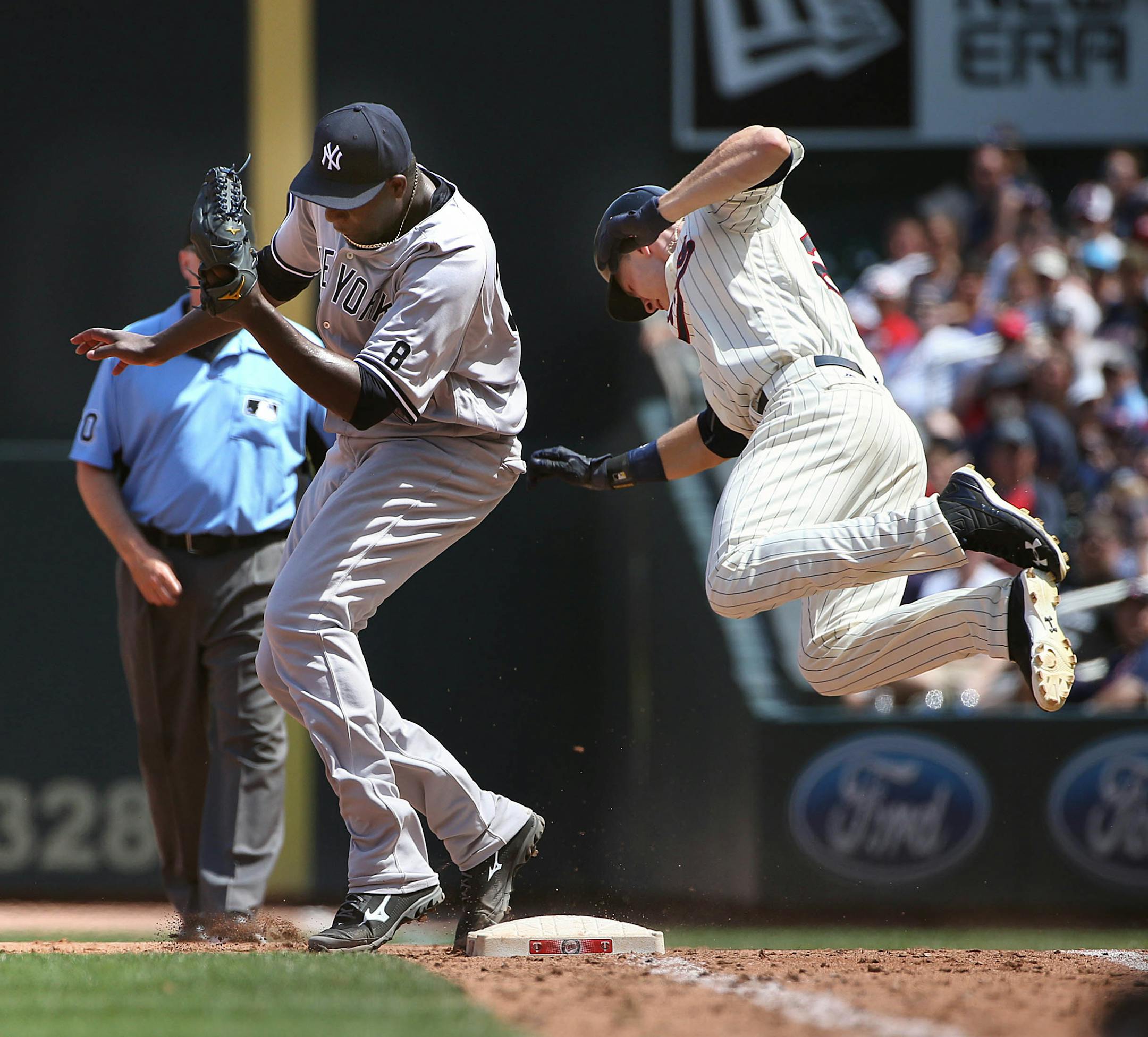 The Twins’ Max Kepler was sent flying after colliding with Yankees pitcher Michael Pineda while beating out a throw to first base.