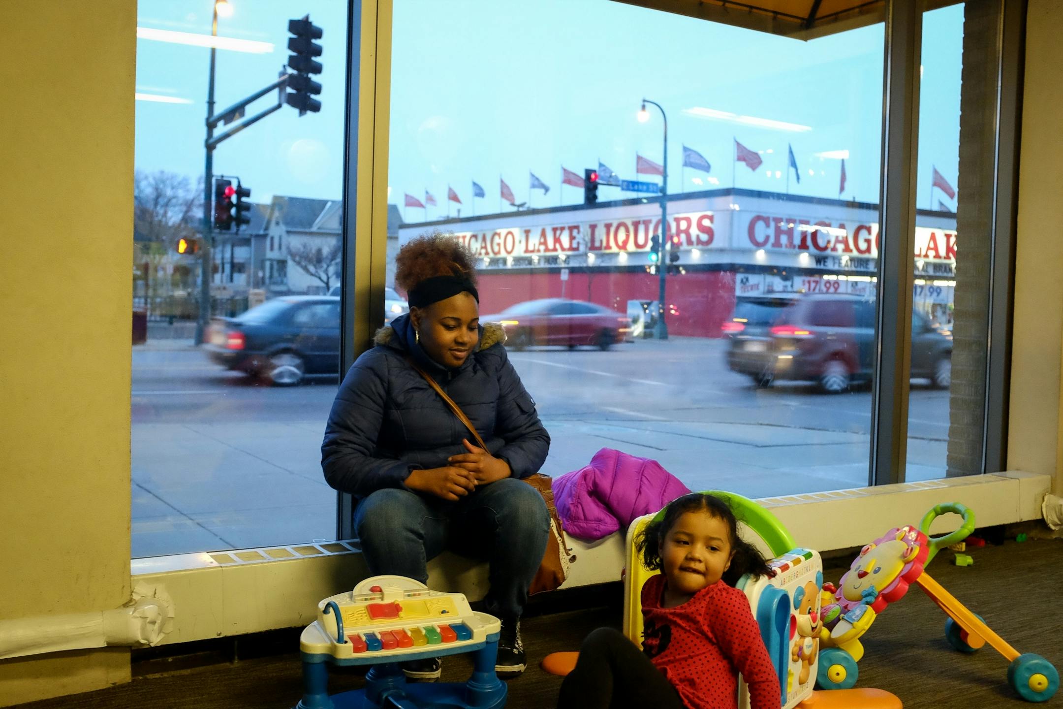 Star Cruz, of Uptown, looked to her daughter Hazel Swan, 4, as they hung out in the children's play area at Midtown Global Market Friday night.