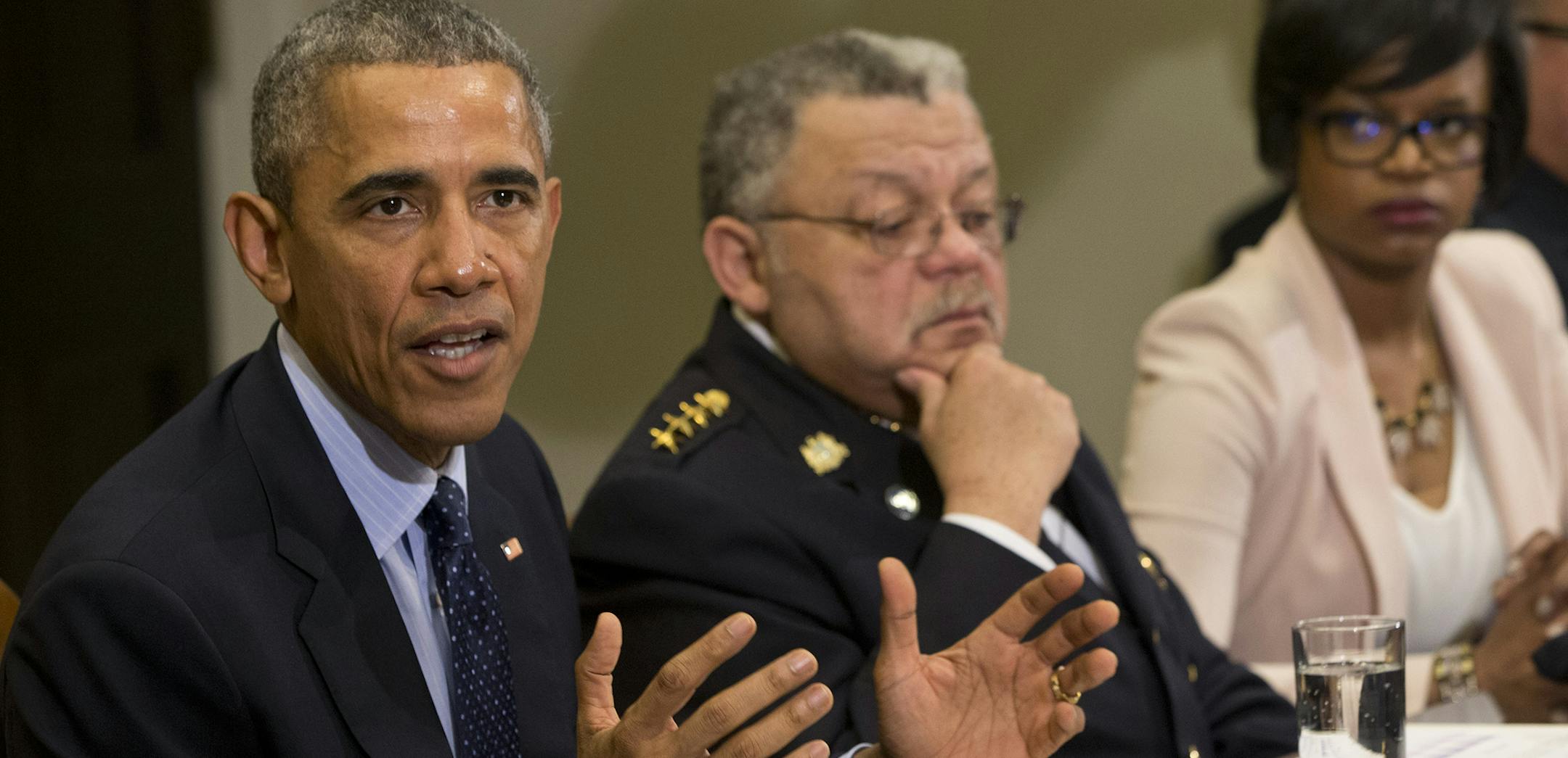 President Barack Obama speaks during a meeting with members of the Task Force on 21st Century Policing, Monday, March 2, 2015, in the Roosevelt Room of the White House in Washington. From left are, the president, Philadelphia Police Commissioner Charles Ramsey, and Brittany Packnett, executive director of Teach For America in St. Louis, Missouri. (AP Photo/Jacquelyn Martin) ORG XMIT: DCJM207