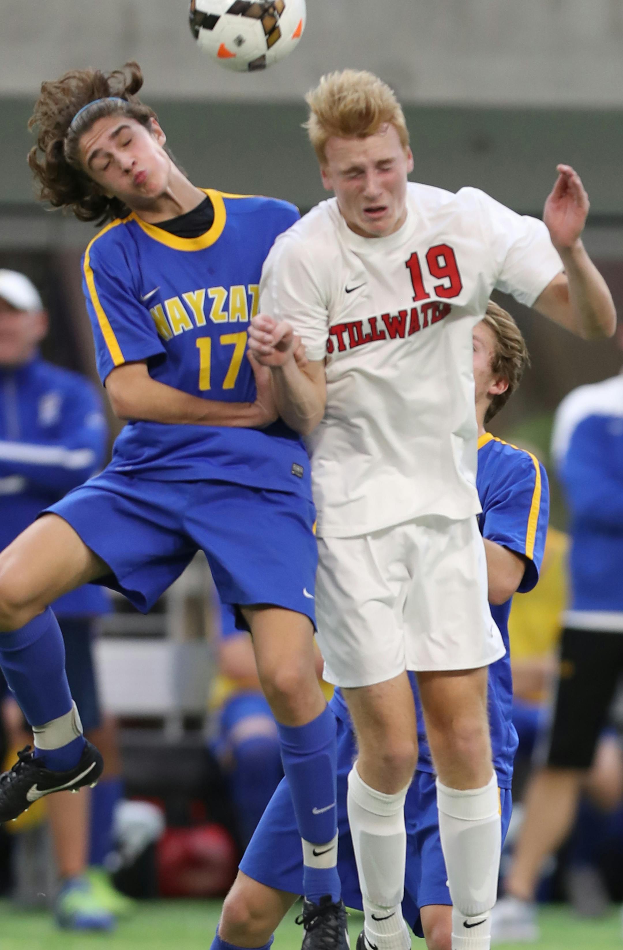 Stuart Sain(17) and Colman Farrington(19) of Stillwater fight for a header.]In the Class 2A soccer championship game between Wayzata and Stillwater at US Bank Stadium.Richard Tsong-Taatarii/rtsong-taatarii@startribune.com