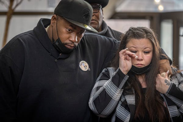 The parents of Daunte Wright, Aubrey Wright, left, and Katie Bryant cry as they wait to speak to the press after the verdict was read at the Hennepin 