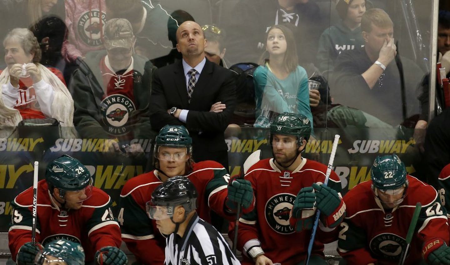 Wild coach Mike Yeo checked the scoreboard during the third period of Saturday's 4-2 loss to the Boston Bruins at Xcel Energy Center. Time was running out on Yeo -- he was fired after the game.