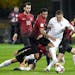 Finland's Robin Lod vies for the ball surrounded by four players from Turkey during a 2018 World Cup Group I qualification soccer match on Oct. 9, 201