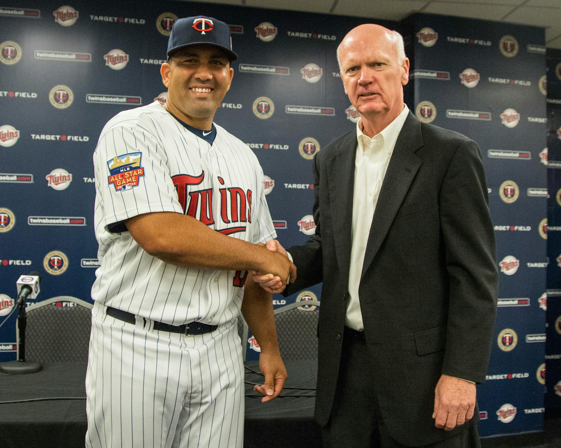 Twins General Manger Terry Ryan greeted Kendrys Morales during Sunday's news conference announcing the signing of the slugger.