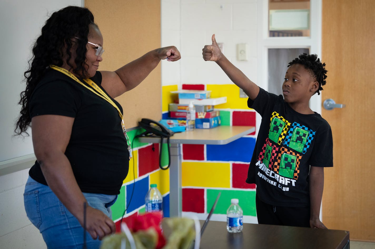 De'sean Davis, second grader at Nellie Stone Johnson Elementary, burns off energy by playing catch with Erin Crosby, support staff member, inside the 'sensory room' during the school day in Minneapolis, Minn., on Wednesday, Dec. 13, 2023.