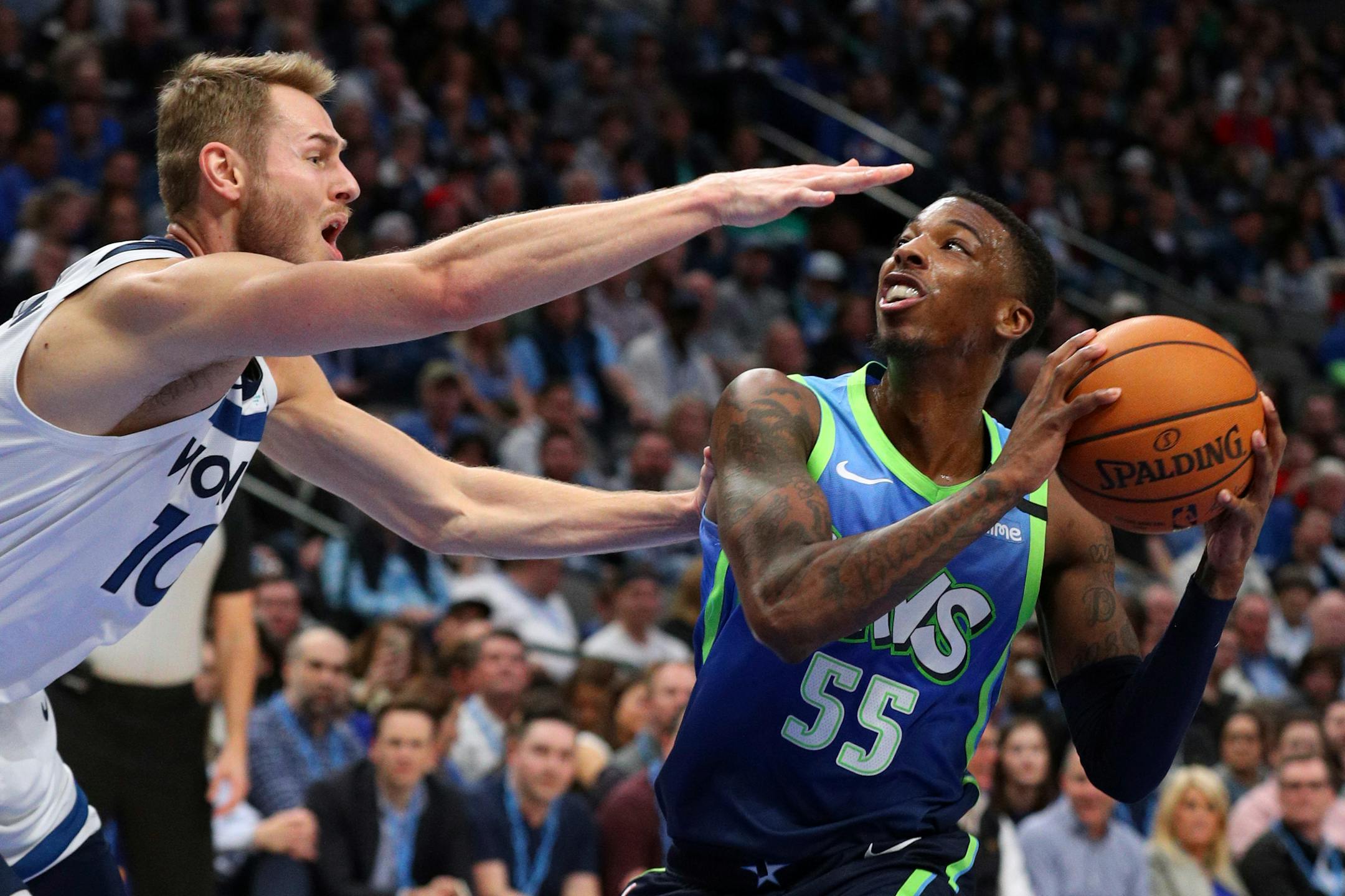Timberwolves guard Jacob Evans tried to defend against a shot by Mavericks guard Delon Wright during the second half Monday.