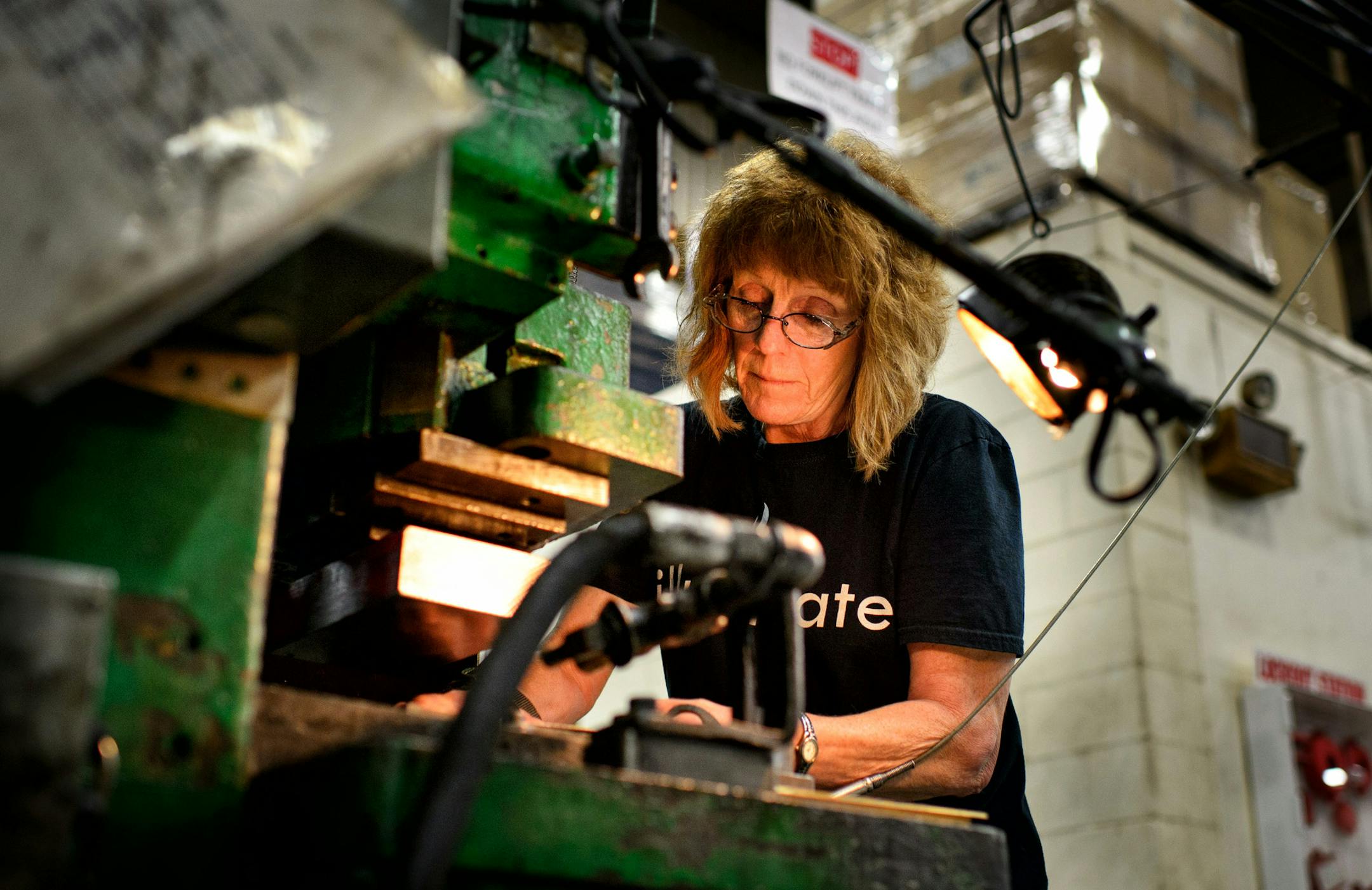 Colleen Klobucar set up an older punch press at Dayton Rogers. ] GLEN STUBBE * gstubbe@startribune.com Friday, June 26, 2015 Dayton Rogers manufacturing company that saved $1/2 M to pay federal taxes last year only to be told Congress passed tax extenders and the money, sitting in savings, didn't need to be saved at all. EDS, Klobucar is (cq)