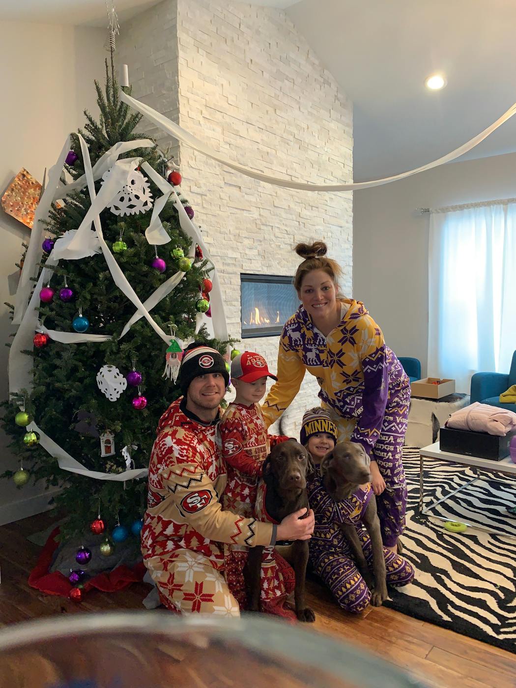 The Golds of Prescott, Wis., celebrated around the Christmas tree in their 49ers and Vikings jammies.