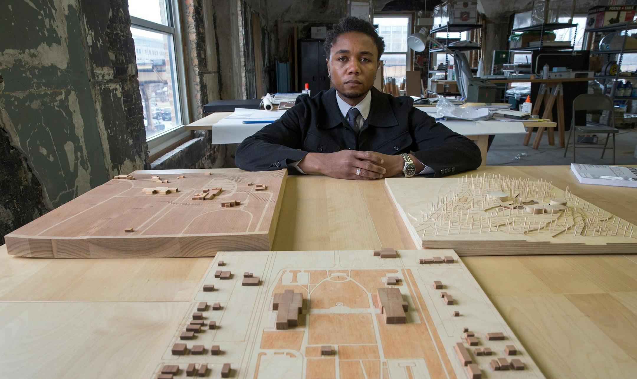 IIT architect professor Marshall Brown poses for portrait in his private architect studio in Chicago, March 27, 2014. At foreground are layouts of other presidential libraries. With his class, Brown developed architectural scenarios for President Obama's presidential library. (Alex Garcia/Chicago Tribune/MCT)