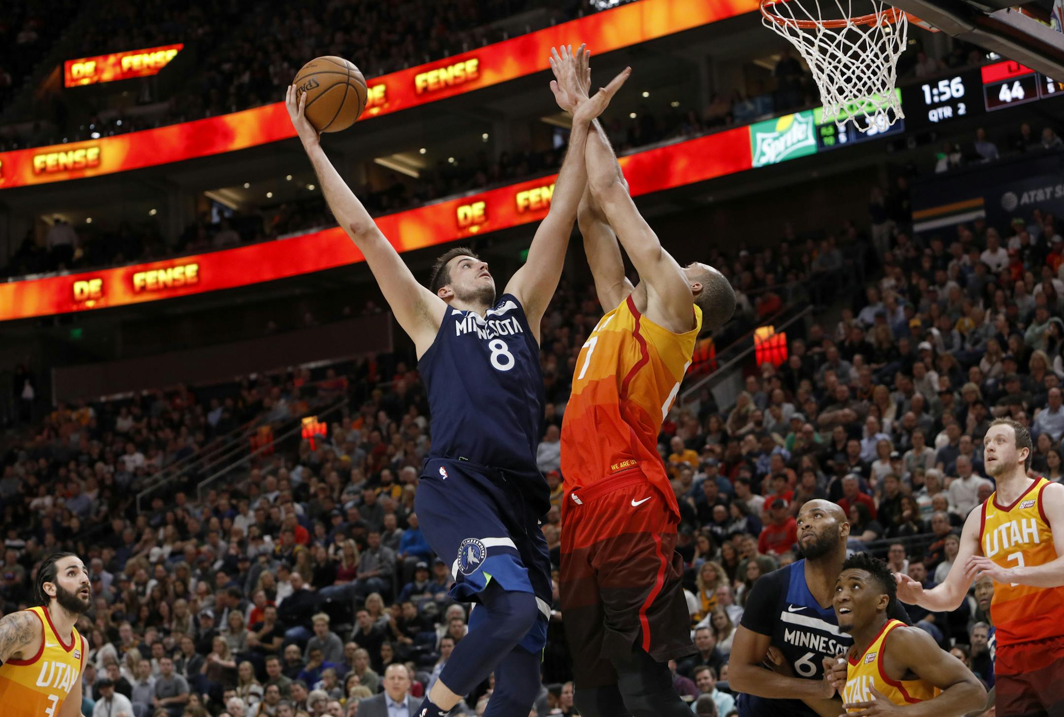 Minnesota Timberwolves' Nemanja Bjelica (8) shoots as Utah Jazz's Rudy Gobert (27) defends during the first half of an NBA basketball game Friday, March 2, 2018, in Salt Lake City. (AP Photo/Kim Raff)