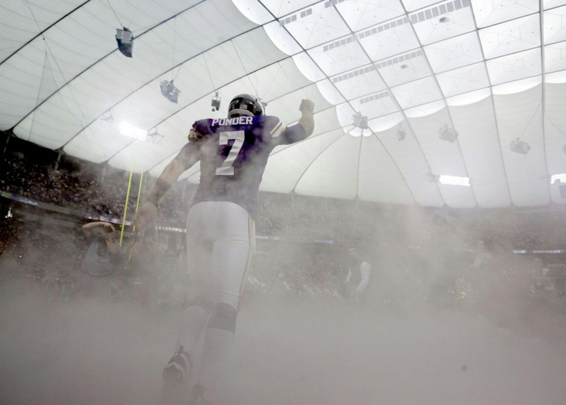 Vikings quarterback Christian Ponder (7) ran on the field during introductions before his first professional start.