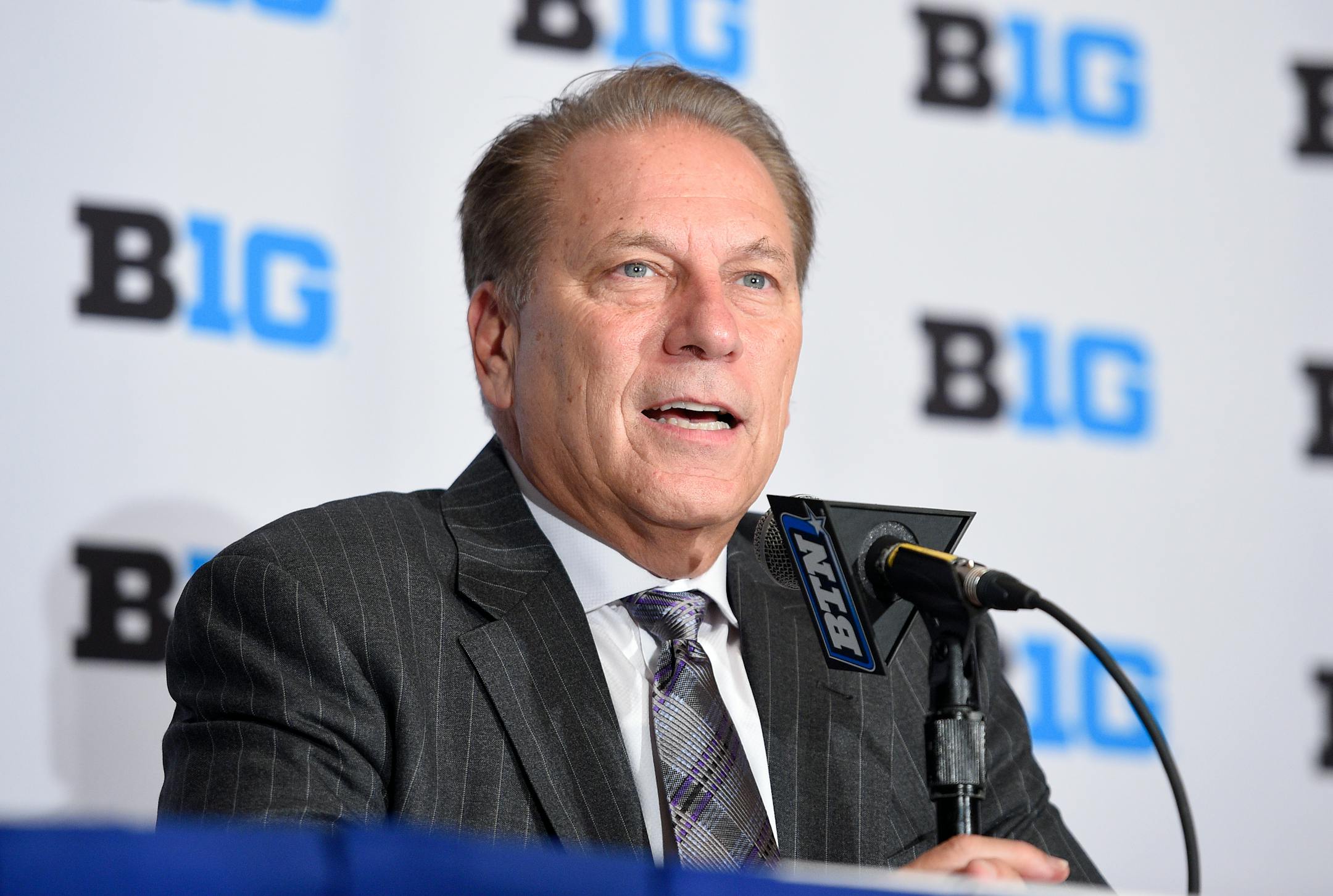 FILE - In this Oct. 13, 2016, file photo, Michigan State head coach Tom Izzo speaks at the Big Ten conference NCAA college basketball media day in Washington. The Big Ten is increasing its conference basketball schedule to 20 games for the men and 18 for the women, starting in the 2018-19 season. The conference announced the change before its men's basketball media day in New York, Thursday, Oct. 19, 2017. (AP Photo/Nick Wass, File)