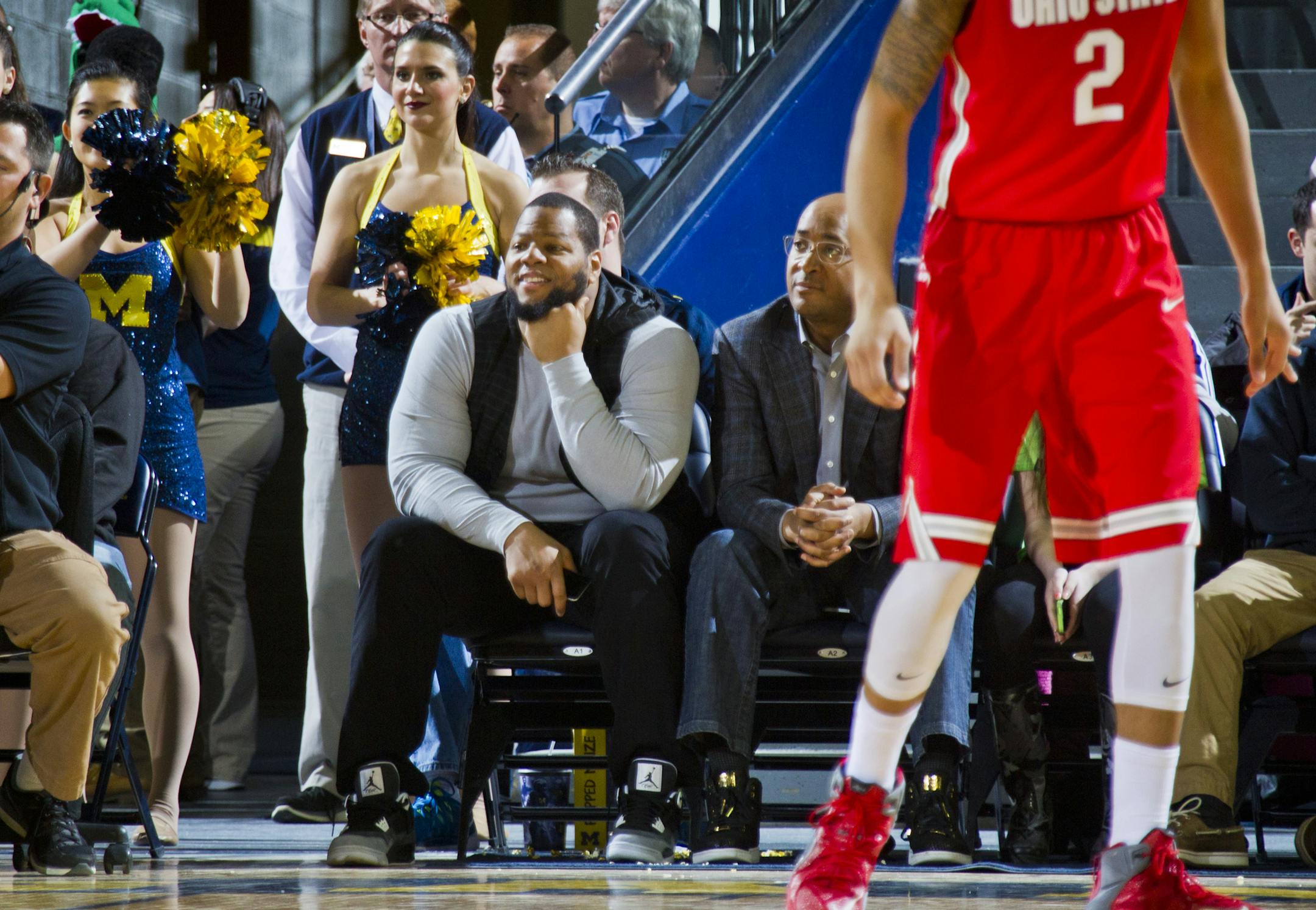 Detroit Lions defensive tackle Ndamukong Suh attends the first half of an NCAA college basketball game between Michigan and Ohio State at Crisler Center in Ann Arbor, Mich., Sunday, Feb. 22, 2015. (AP Photo/Tony Ding)