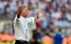Iran's head coach Carlos Queiroz reacts to a call during the group F World Cup soccer match between Argentina and Iran at the Mineirao Stadium in Belo