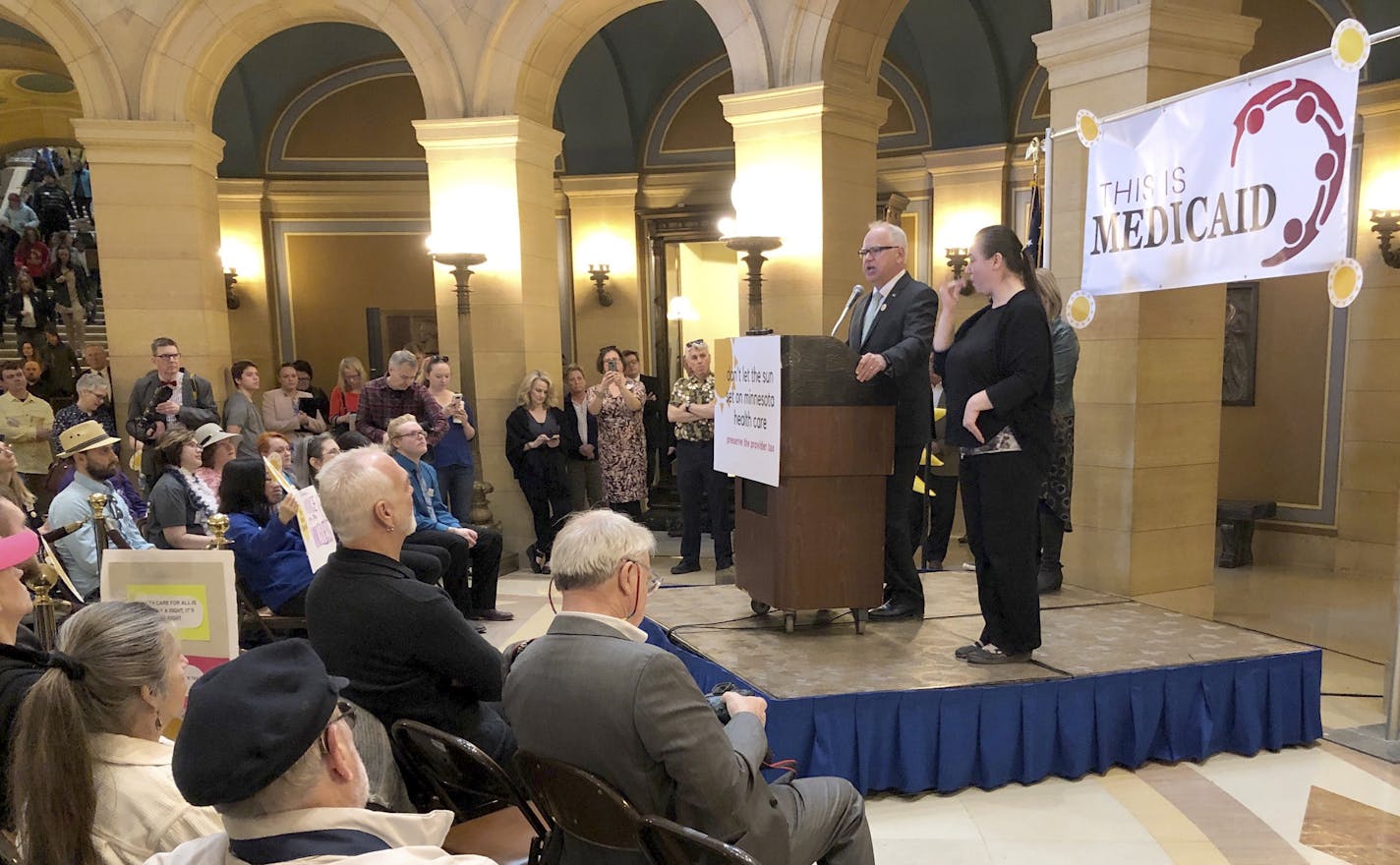 Minnesota Gov. Tim Walz speaks in support of preserving the state's health care provider tax during a rally in the state Capitol rotunda on Thursday, March 21, 2019 in St. Paul. Walz is turning up the heat on lawmakers to try to prevent the state's 2 percent tax on health care providers from expiring at the end of the year. (AP Photo/Steve Karnowski)