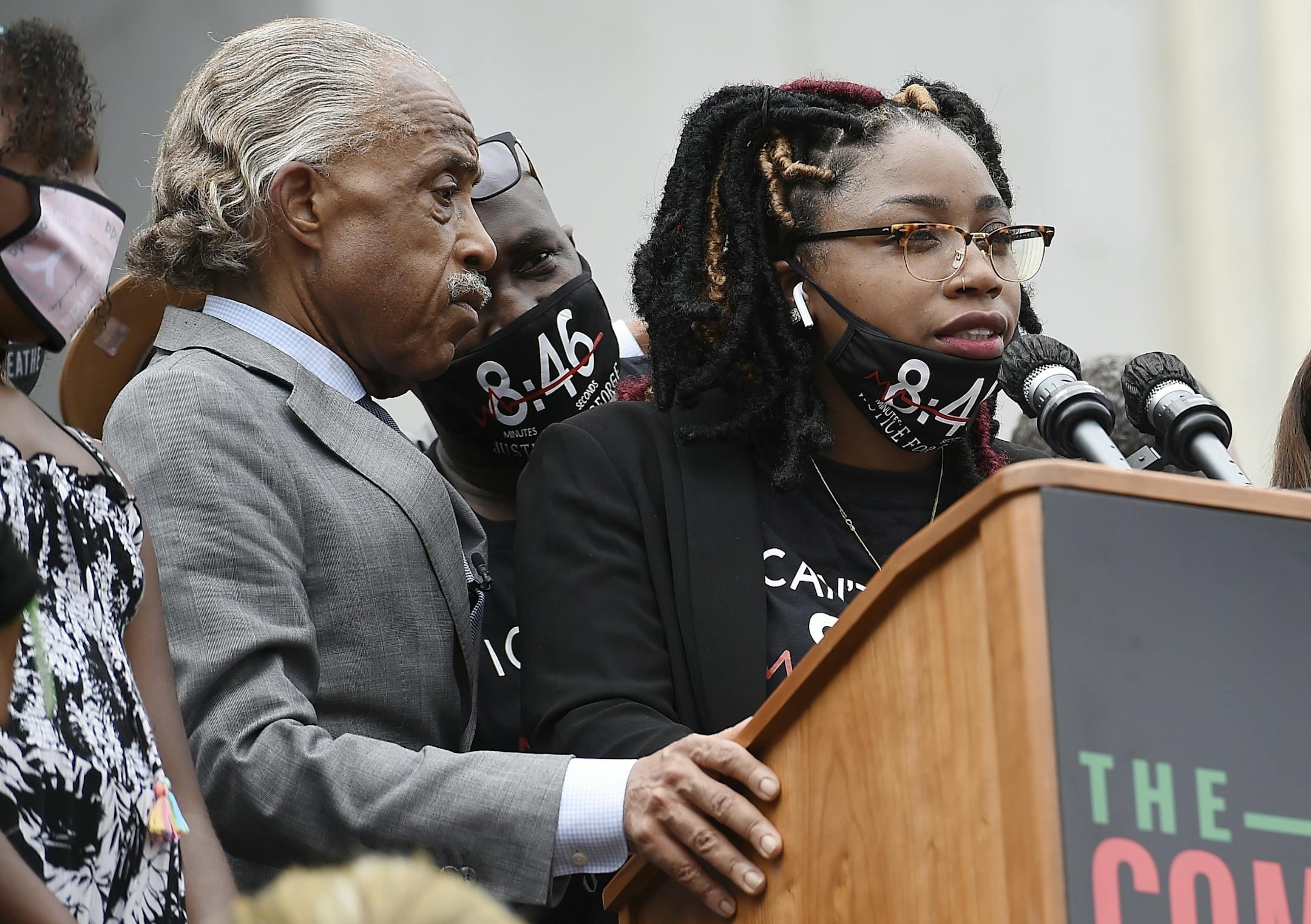 George Floyd's sister Bridgett Floyd spoke at the March on Washington on Aug. 28 as the Rev. Al Sharpton looked on. Bridgett Floyd and other family members have started a nonprofit in honor of George Floyd.