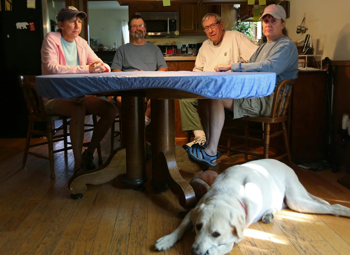 Joseph Zacher's family sits around the "Jefferson roundtable," as they like to call it, in the home of Tom Jefferson in Birchwood Village, Minn. (From left: Claudia Beckman, Greg Beckman, Tom Jefferson, Colleen Jefferson and Langley the dog.) Zacher, a Level III sex offender, lived in the home for three weeks before officials revoked his parole after a random inspection found a DVD player given as a gift for Tom&#xed;s 86th birthday that could connect to the internet. ] Birchwood Village, a town