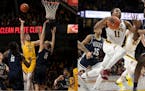 Brock Stull, left, played well for the Gophers in their victory over Wisconsin, but it took away minutes from fellow guard Isaiah Washington, right.