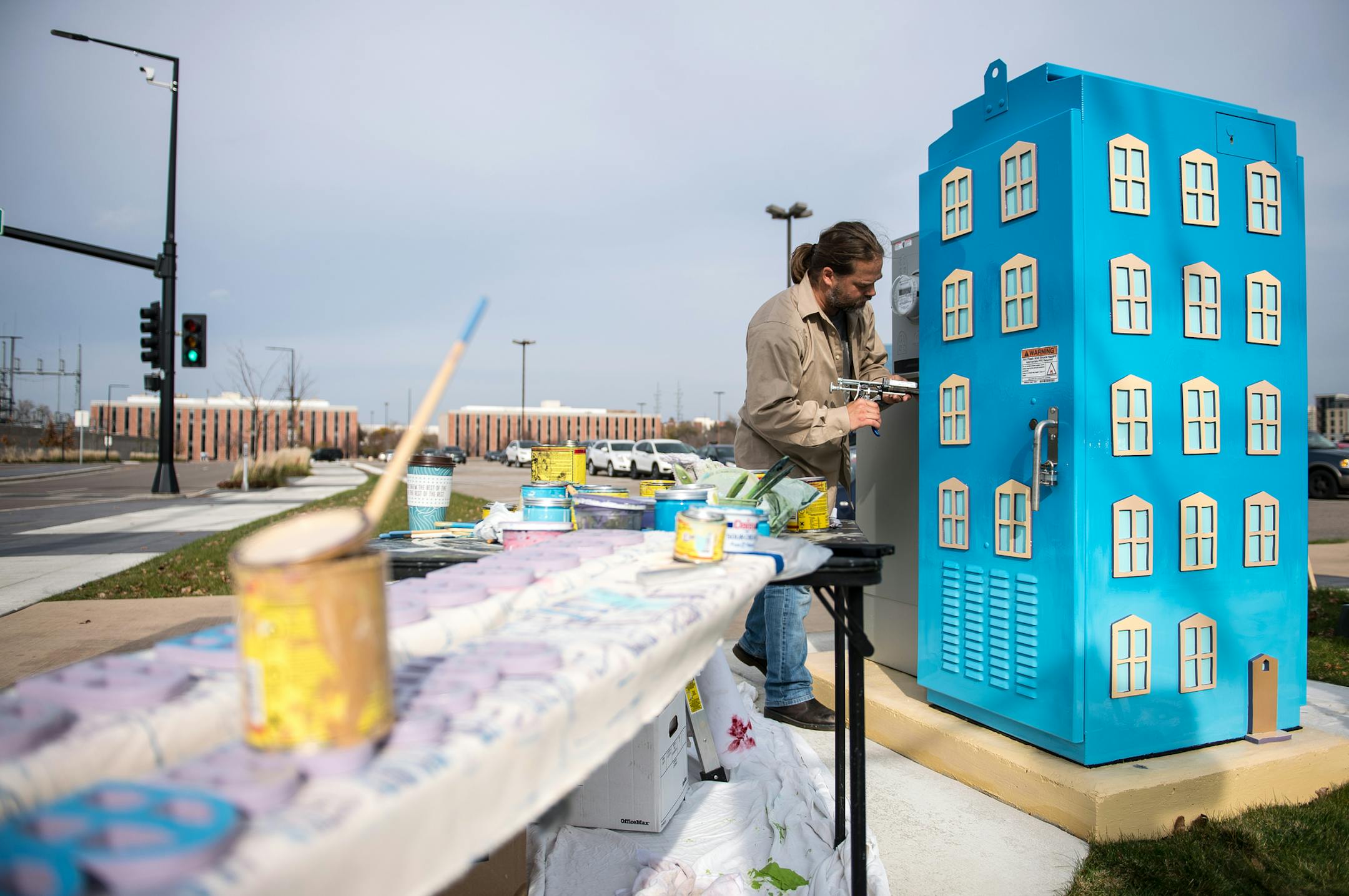 Erik Sletten, an artist from Stillwater, turned utility boxes into works of art at the intersection of 30th Avenue South and Lindau Lane in Bloomington's South Loop District. ] (AARON LAVINSKY/STAR TRIBUNE) aaron.lavinsky@startribune.com The South Loop District in Bloomington is a place that has housed rich culture in the past, including the Metropolitan Stadium and the Minnesota Valley National Wildlife Refuge. Of course, the area is now known more for the Mall of America, proximity to the airp