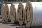 Giant rolls holding miles of fiber optic cable were stored at a construction yard in northern Minnesota in 2012 before being installed as a part of a 