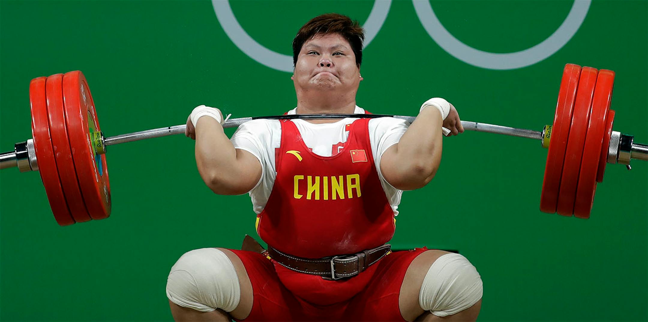 Gold medal winner Meng Suping, of China, competes in the women's 75kg weightlifting event at the 2016 Summer Olympics in Rio de Janeiro, Brazil, Sunday, Aug. 14, 2016.