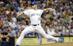 Milwaukee Brewers relief pitcher Neal Cotts throws during the sixth inning of a baseball game against the Chicago Cubs Friday, July 31, 2015, in Milwa