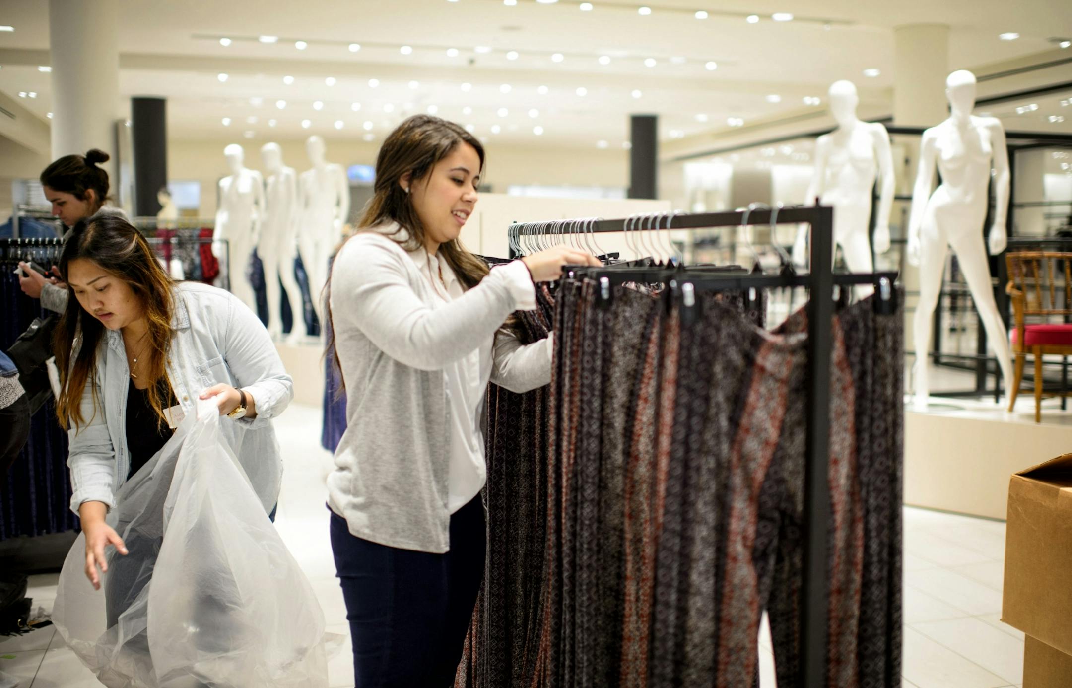 Morgan Phipps, right, placed new clothing on racks in the Top Shop section at the new Nordstrom Ridgedale, Minnetonka. at the new Nordstrom Ridgedale, Minnetonka.