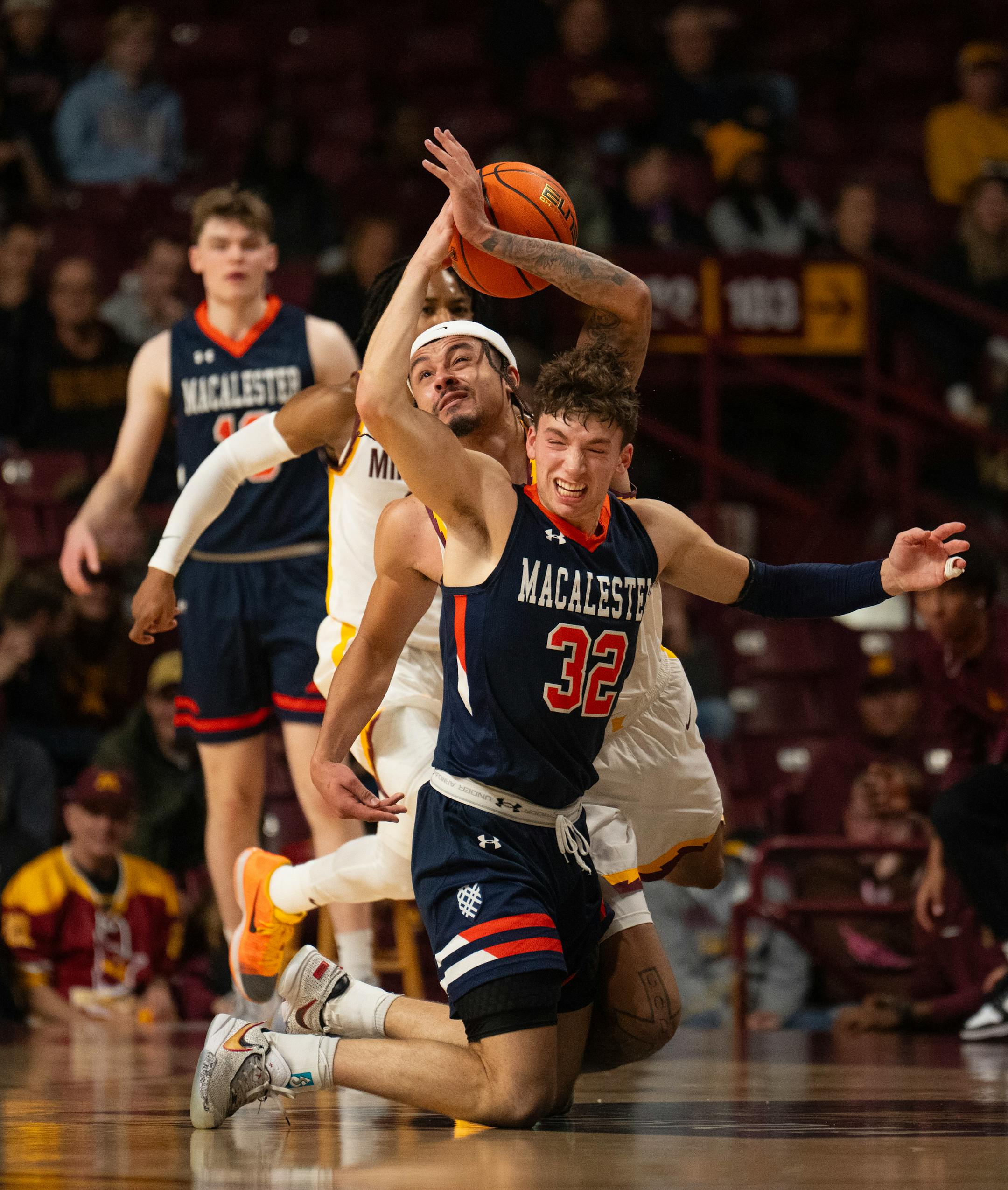 Minnesota Gophers guard Braeden Carrington (4) stripped the ball from Macalester Scots guard Caleb Williams (32) in the first half.