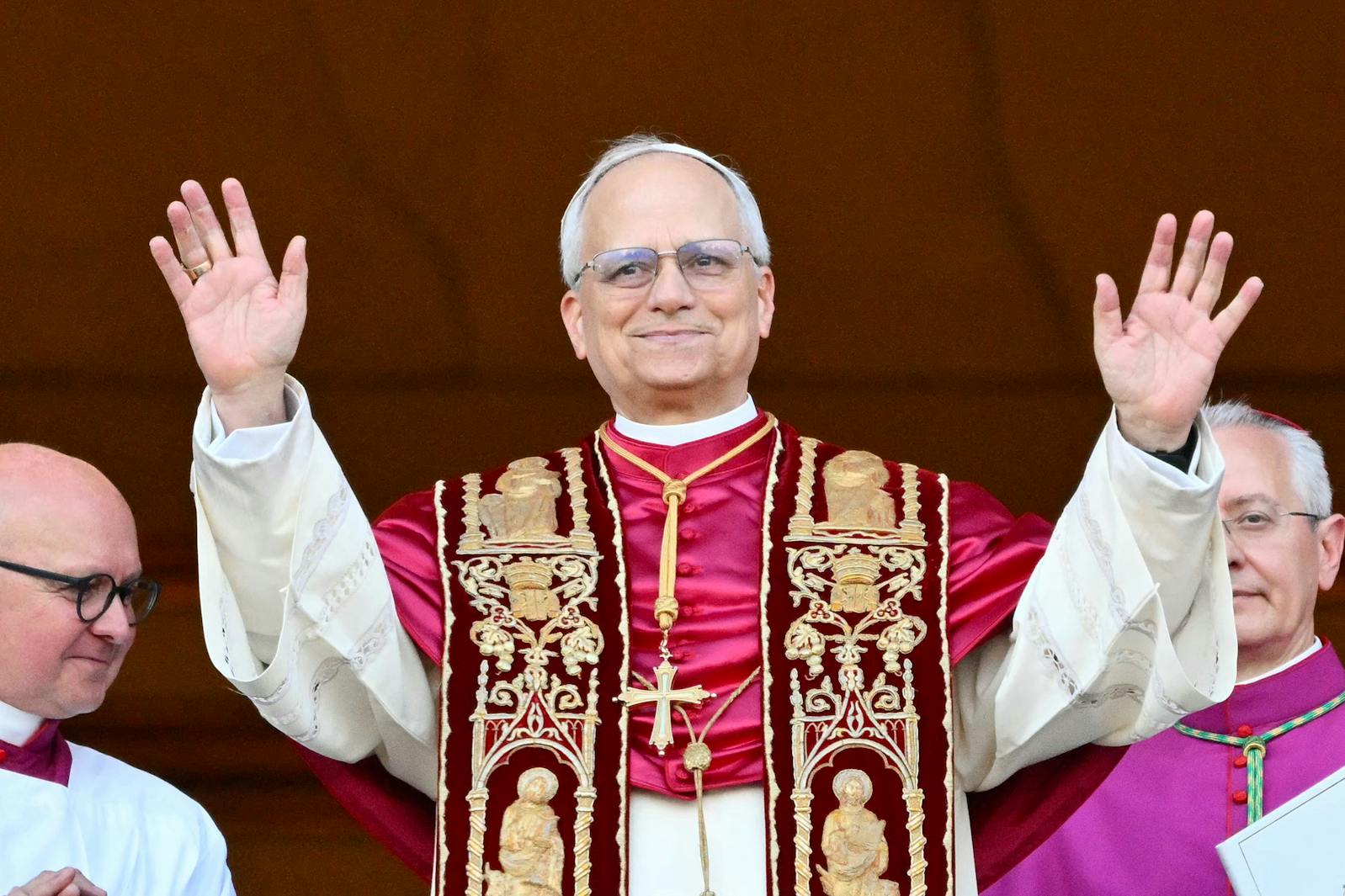 Newly elected Pope Leo XIV, Robert Prevost arrives on the main central loggia balcony of the St Peter's Basilica for the first time, after the cardinals ended the conclave, in The Vatican, on Thursday, May 8, 2025. Robert Francis Prevost was on Thursday elected the first pope from the United States, the Vatican announced. A moderate who was close to Pope Francis and spent years as a missionary in Peru, he becomes the Catholic Church's 267th pontiff, taking the papal name Leo XIV.
