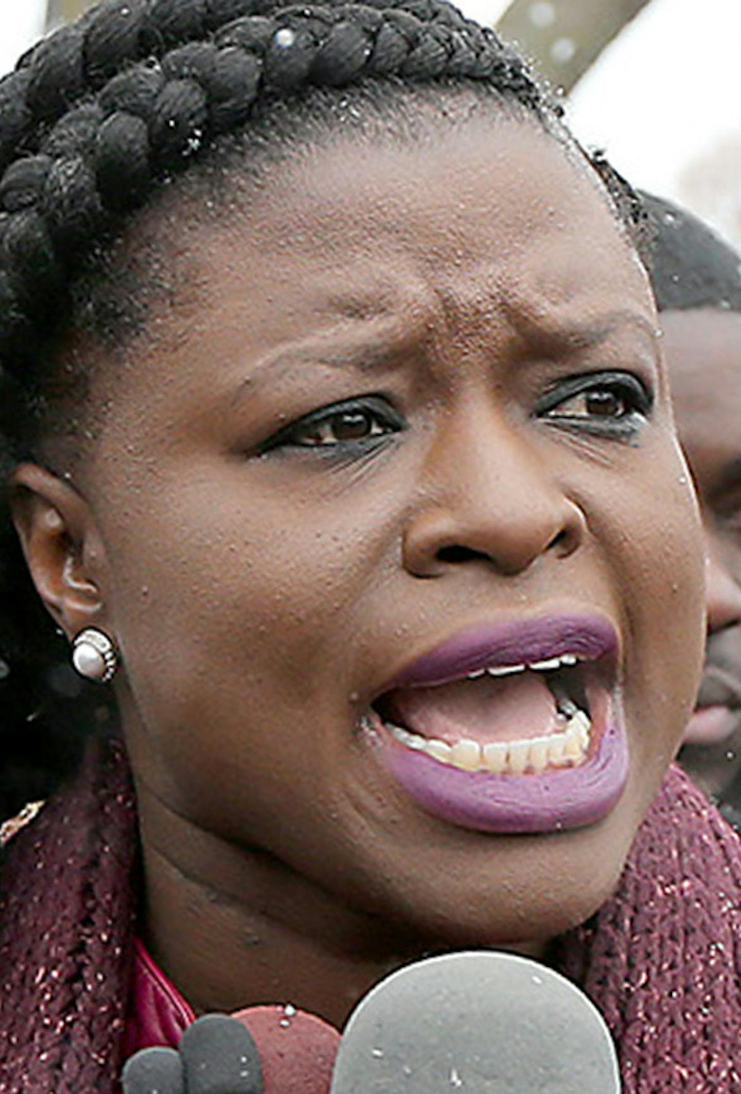 Standing before other protestors, Minneapolis NAACP President Nekima Levy-Pounds spoke to the press demanding that the police release the video of Jamar Clark's shooting, outside the Fourth Police Precinct, Wednesday, November 4, 2015 in Minneapolis, MN. ] (ELIZABETH FLORES/STAR TRIBUNE) ELIZABETH FLORES &#xef; eflores@startribune.com ORG XMIT: MIN1511191224060916